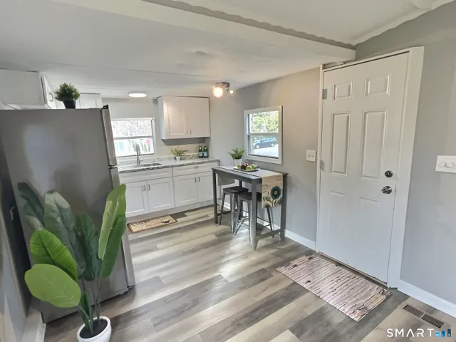 a living room with furniture and a rug