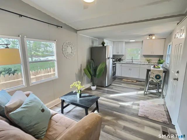 a living room with furniture and a window