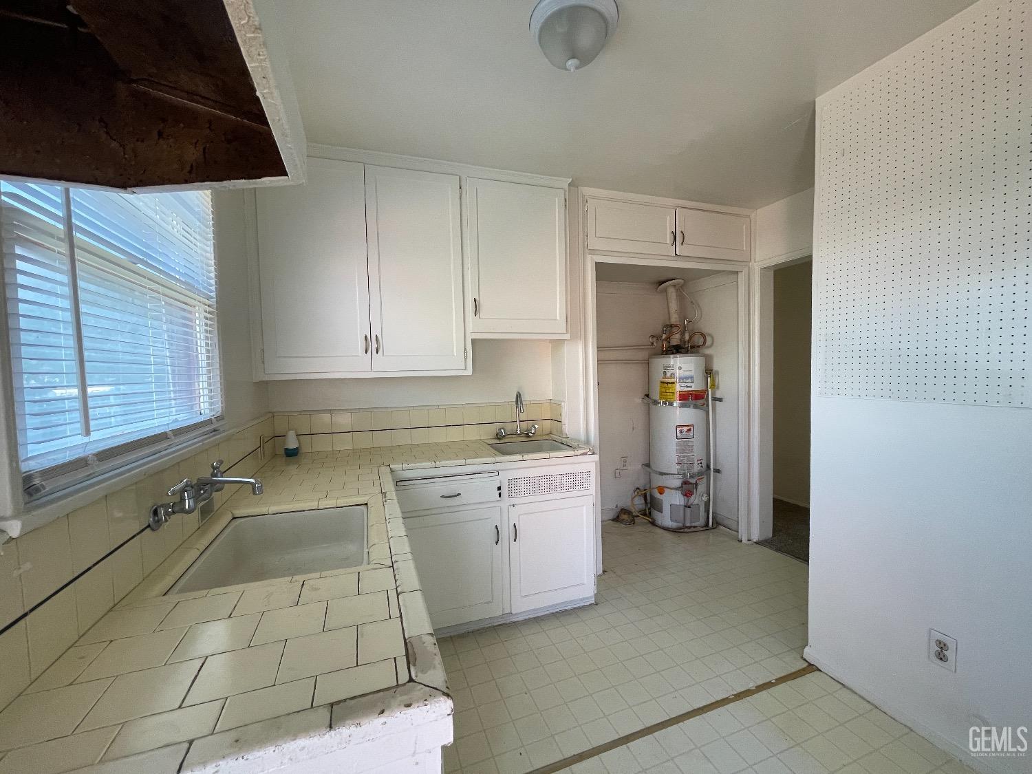 Undisclosed Address Bakersfield, CA 93304 - Photo 11 of 17 a utility room with cabinets