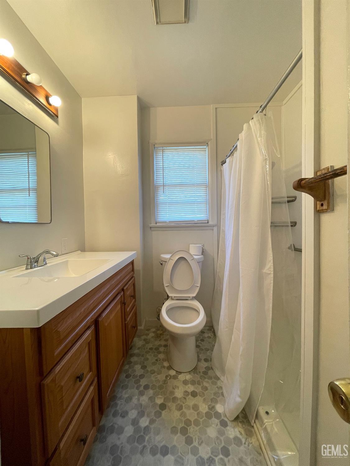 Undisclosed Address Bakersfield, CA 93304 - Photo 15 of 17 a bathroom with a sink toilet and shower