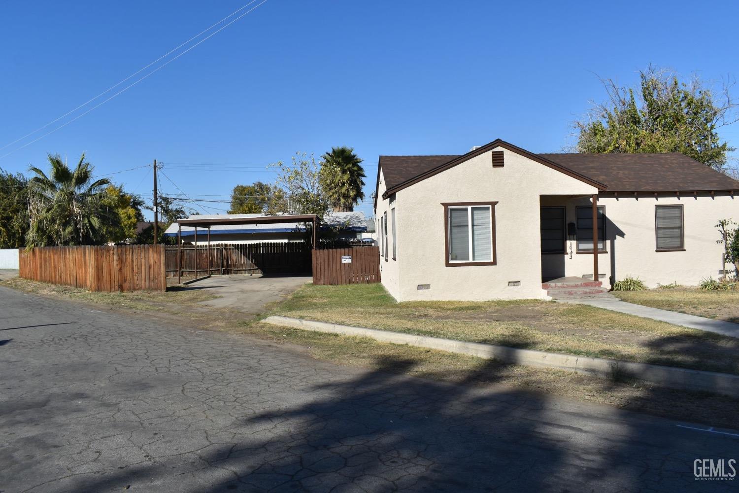 Undisclosed Address Bakersfield, CA 93304 - Photo 5 of 17 a view of a house with a backyard