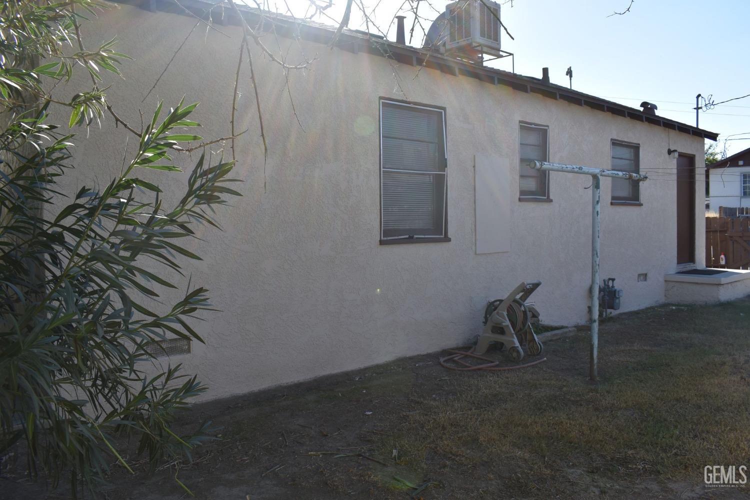 Undisclosed Address Bakersfield, CA 93304 - Photo 9 of 17 a backyard of a house with table and chairs