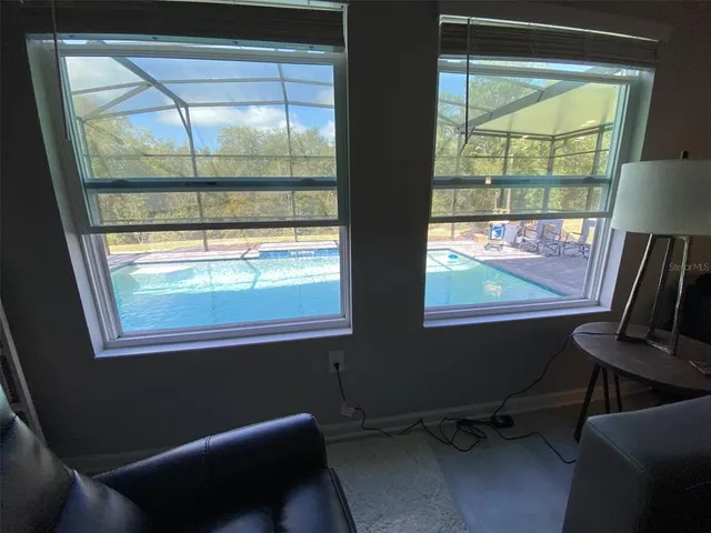 a view of a chairs and table in the roof