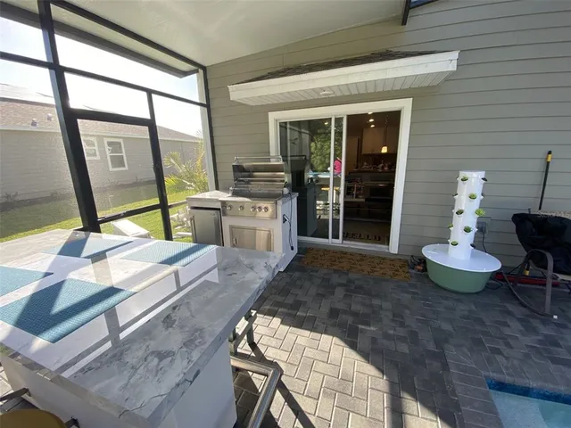 a view of walk in closet with clothes