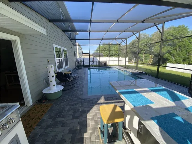 a utility room with cabinets and washer