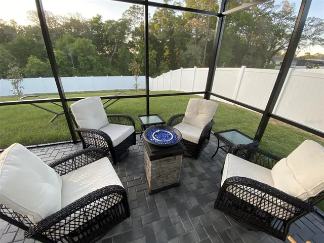 a bedroom with a bed a couch and dresser