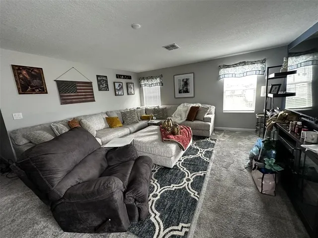 a bedroom with bed and window