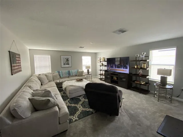 a view of a workspace with furniture