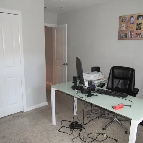 a bathroom with a sink a toilet a mirror and shower