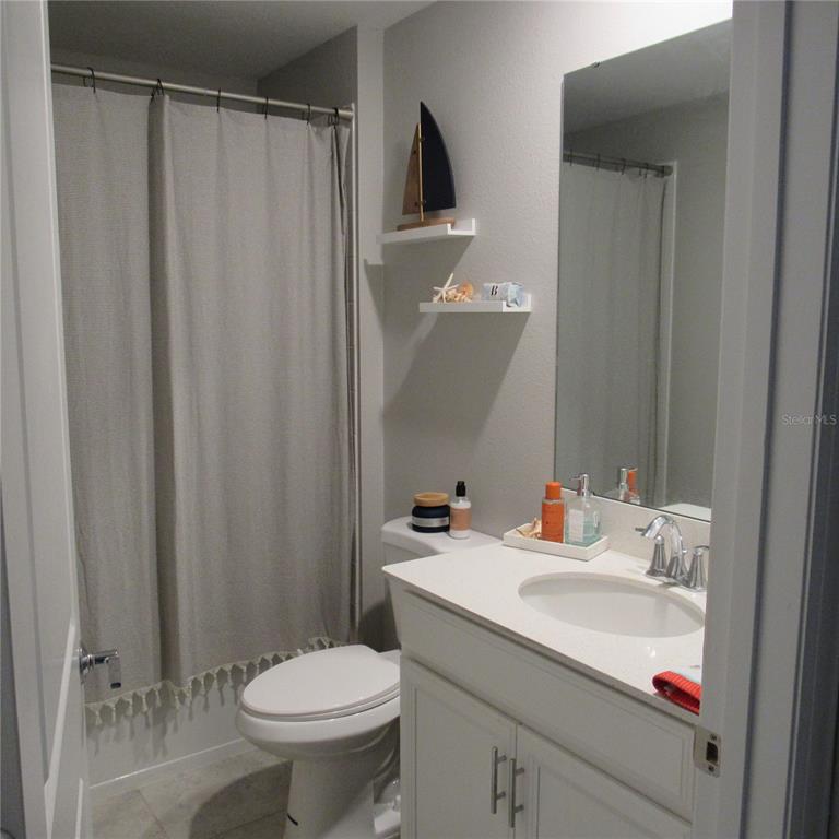 5686 Alenlon Way Mount Dora, FL 32757 - Photo 42 of 62 a bathroom with a sink toilet and shower