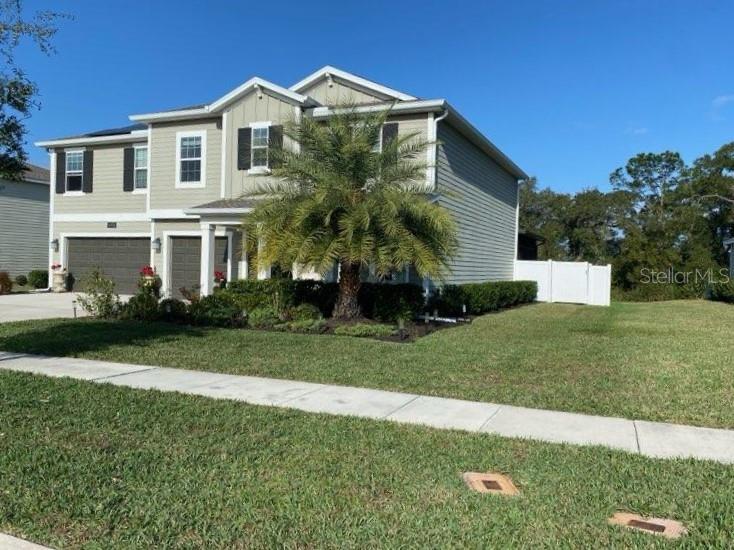 5686 Alenlon Way Mount Dora, FL 32757 - Photo 5 of 62 a front view of a house with a yard