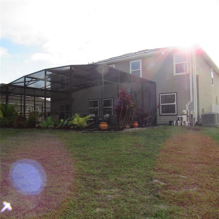 5686 Alenlon Way Mount Dora, FL 32757 - Photo 51 of 62 a backyard of a house