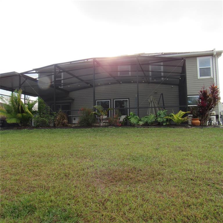 5686 Alenlon Way Mount Dora, FL 32757 - Photo 52 of 62 a view of a backyard