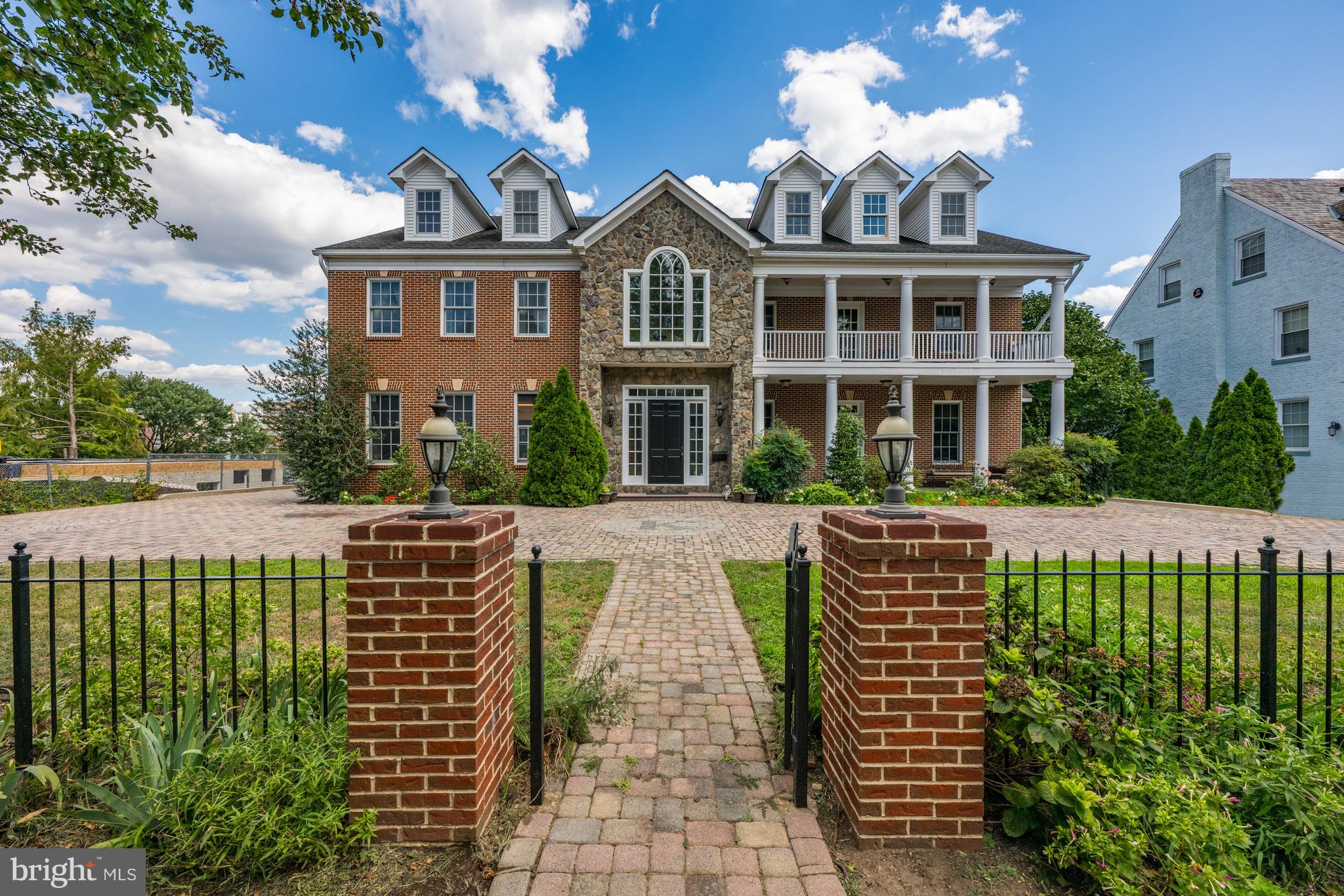 1701 South Arlington Ridge Road Arlington, VA 22202 - Photo 11 of 90 a front view of a house with a garden