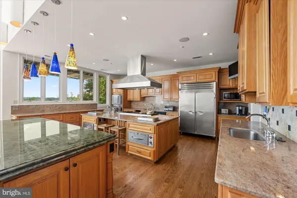 a bedroom with furniture and a large window