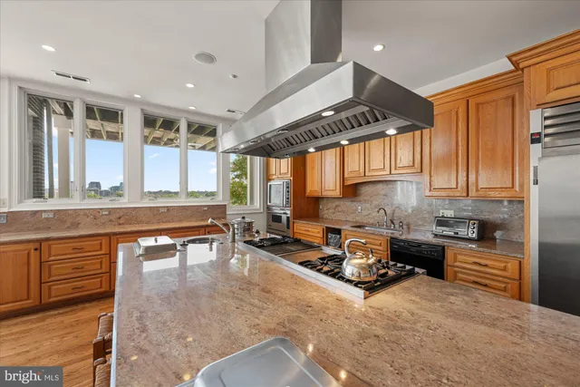a bedroom with bed and wooden floor