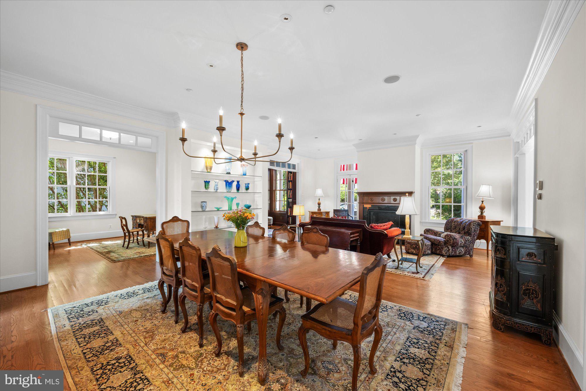 1701 South Arlington Ridge Road Arlington, VA 22202 - Photo 34 of 90 a view of a dining room and livingroom furniture wooden floor a rug and a chandelier