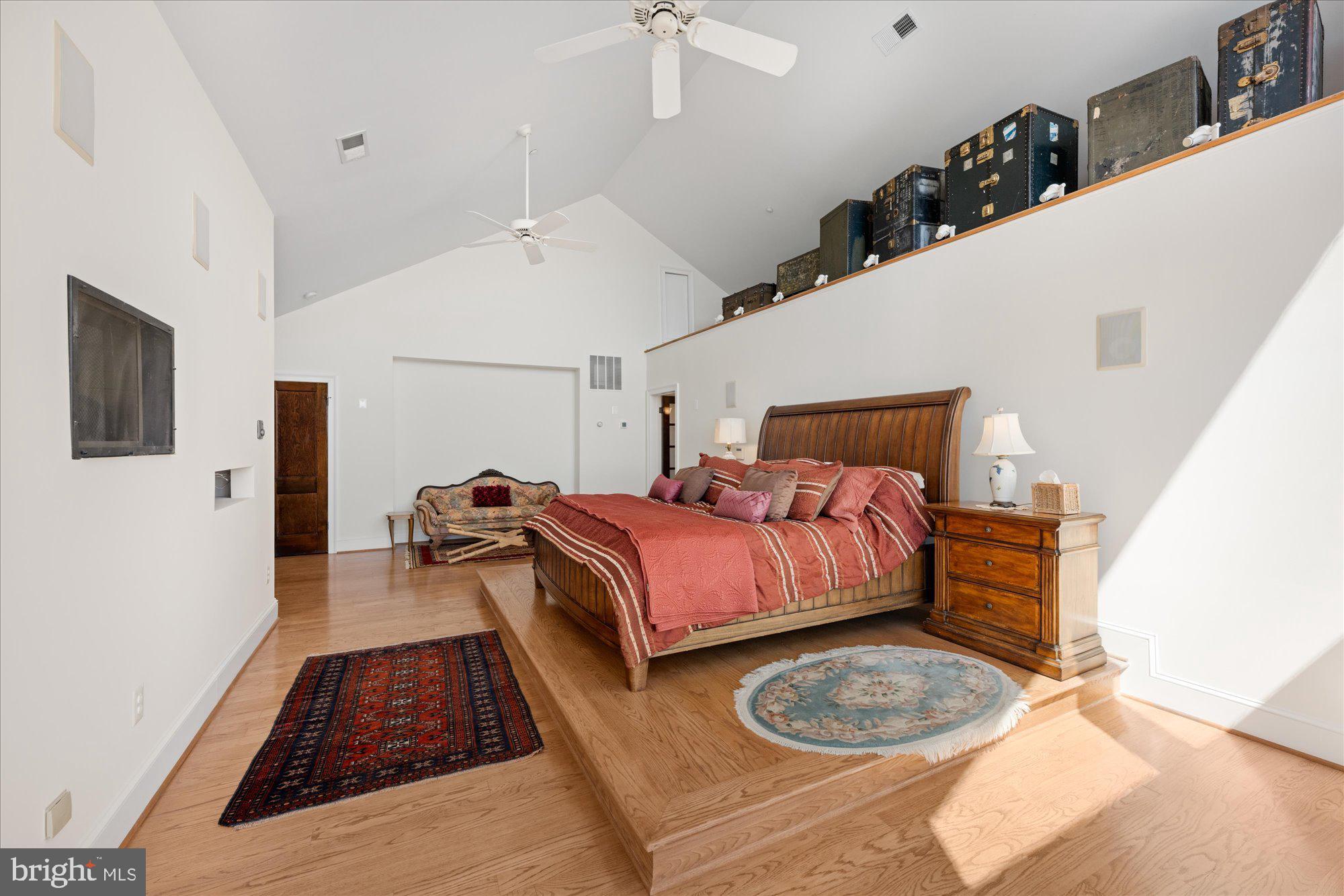 1701 South Arlington Ridge Road Arlington, VA 22202 - Photo 48 of 90 a bedroom with bed and wooden floor