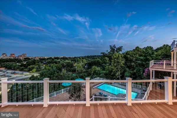a living room with fireplace furniture and a large window