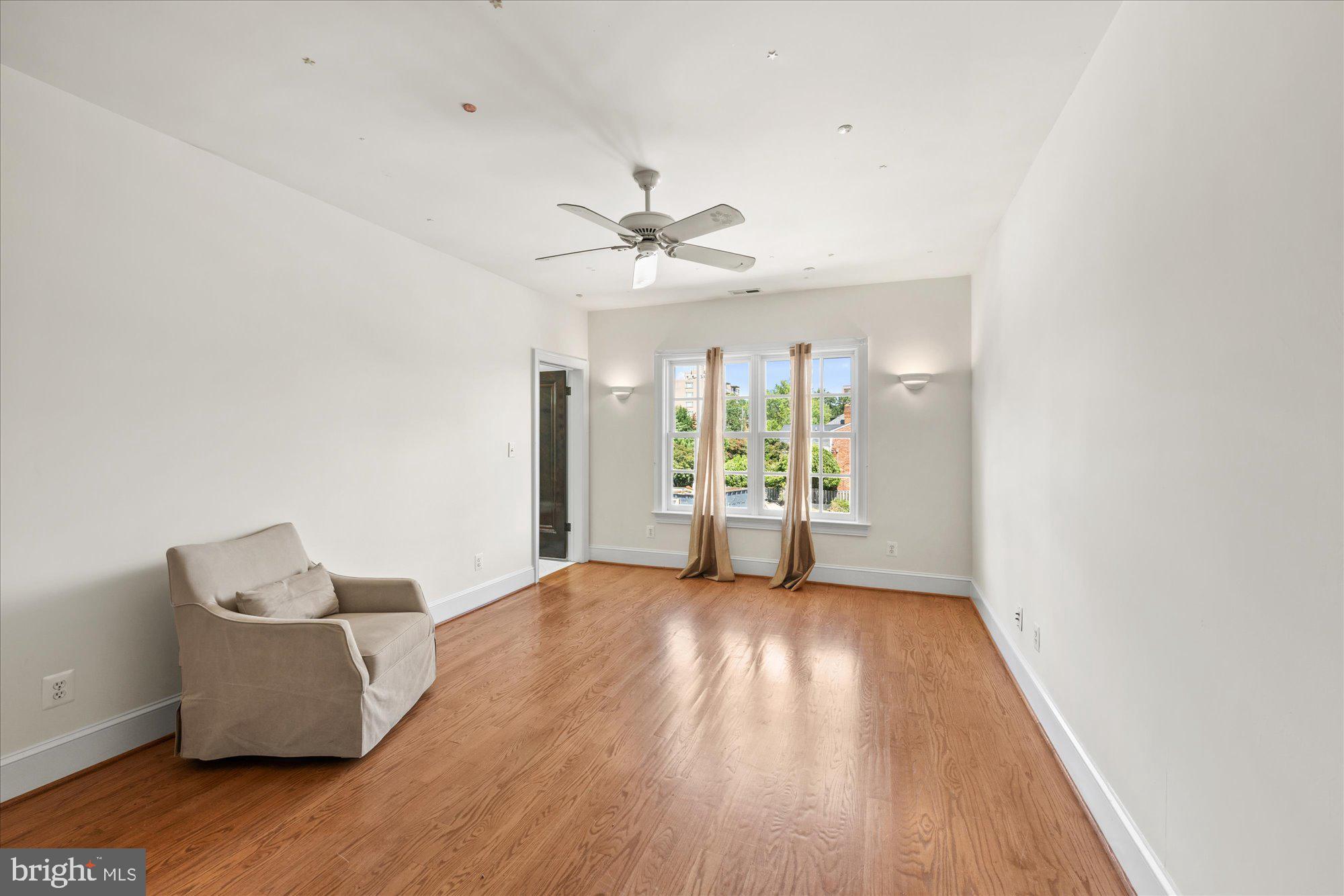 1701 South Arlington Ridge Road Arlington, VA 22202 - Photo 53 of 90 wooden floor in an empty room with a window