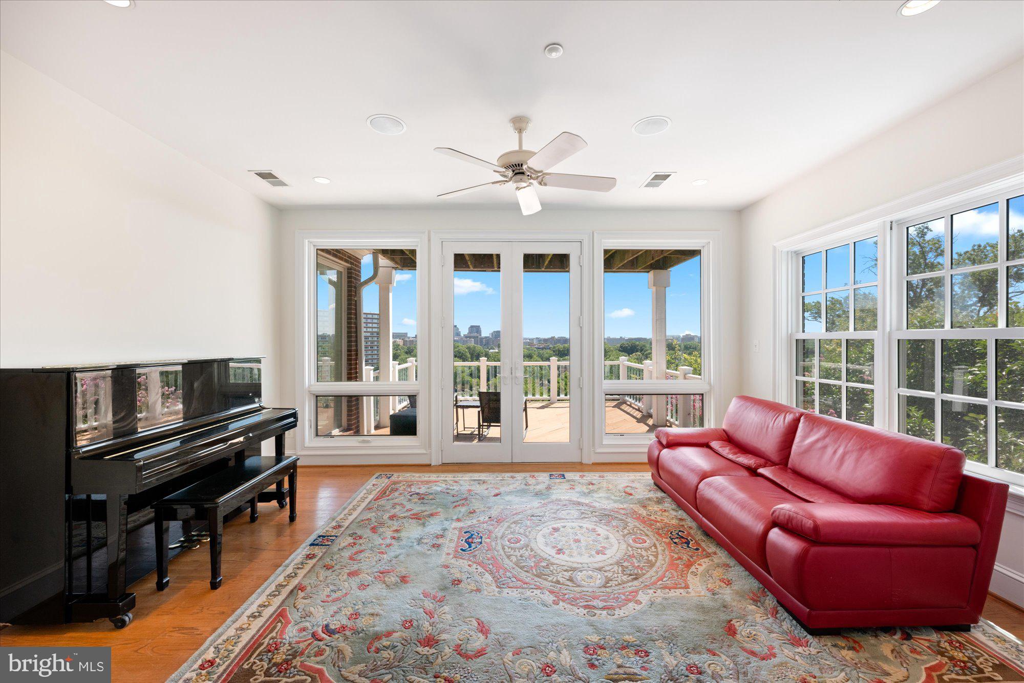 1701 South Arlington Ridge Road Arlington, VA 22202 - Photo 60 of 90 a living room with furniture fireplace and flat screen tv
