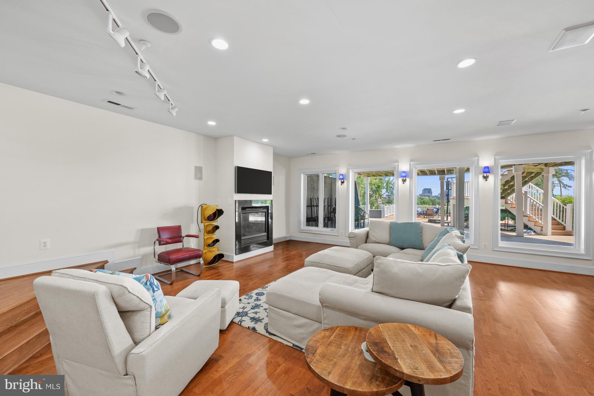 1701 South Arlington Ridge Road Arlington, VA 22202 - Photo 75 of 90 a living room with furniture and a flat screen tv