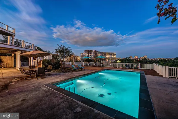 a kitchen with kitchen island granite countertop a sink and a stove