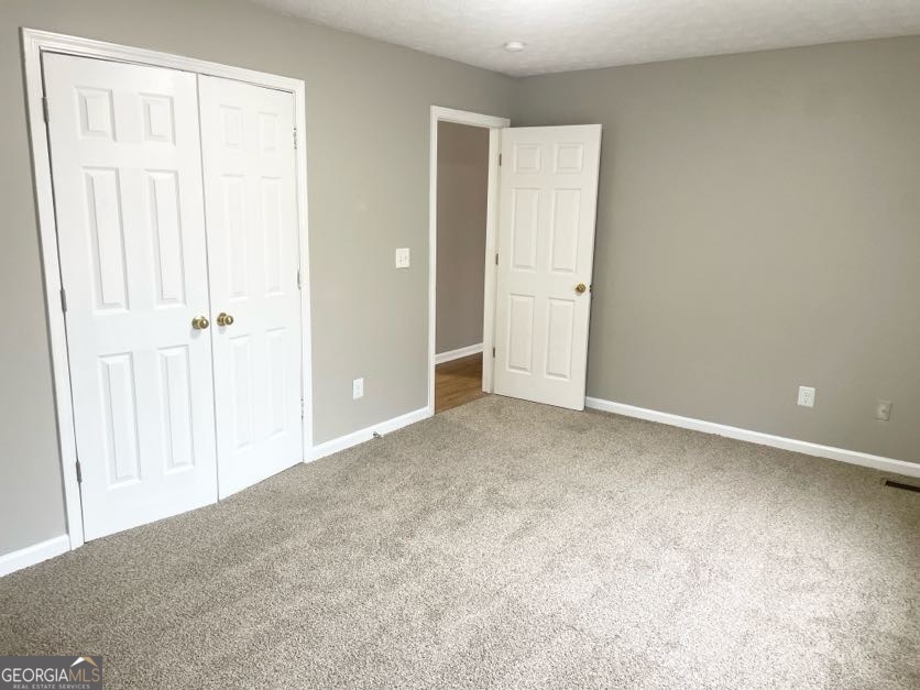 111 West Burke Street, Unit C1 Stockbridge, GA 30281 - Photo 13 of 17 an empty room with closet area