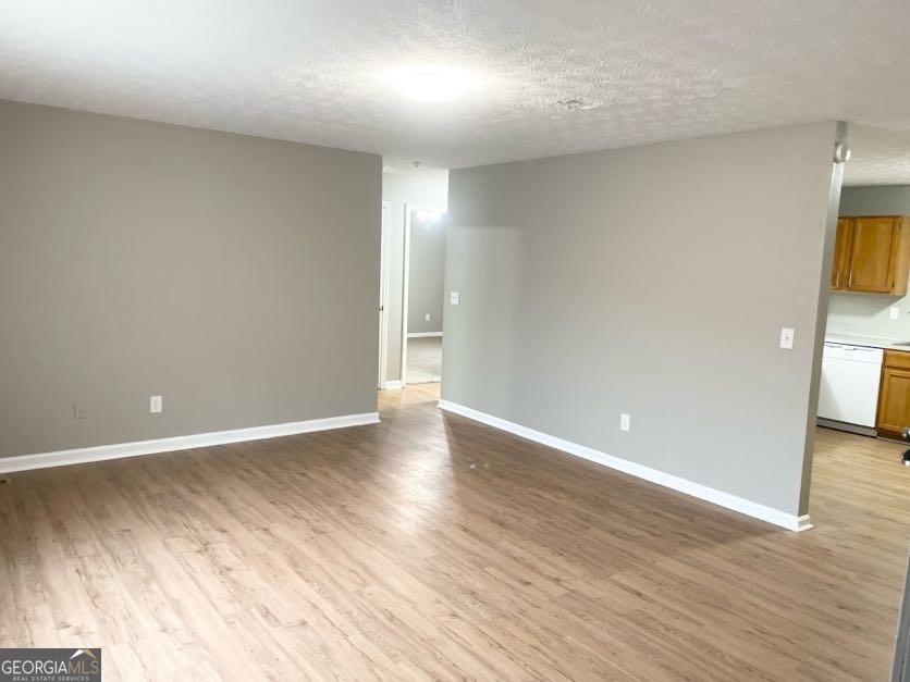 111 West Burke Street, Unit C1 Stockbridge, GA 30281 - Photo 3 of 17 a view of an empty room with wooden floor