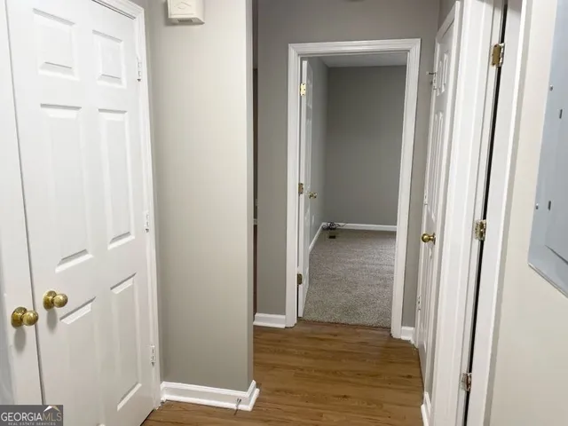 a view of a bathroom from a corridor