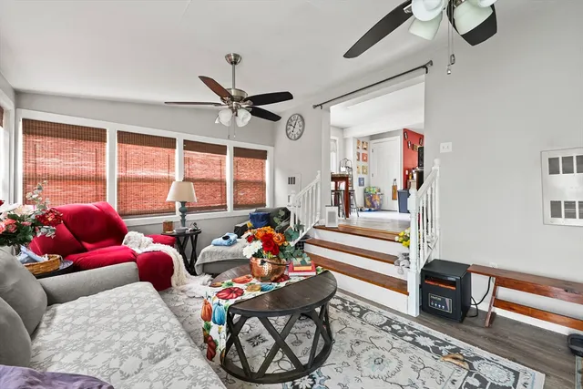 a bed room with furniture and a large window