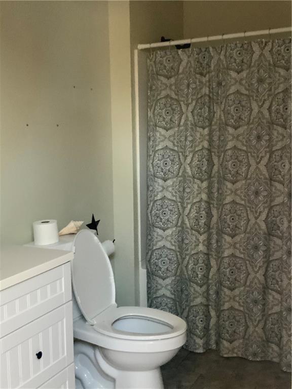 102 Memorial Road West Alexander, PA 15376 - Photo 13 of 19 a white toilet sitting next to a shower curtain