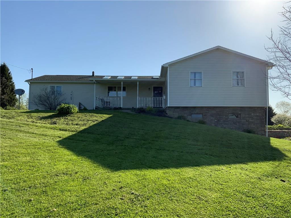 102 Memorial Road West Alexander, PA 15376 - Photo 14 of 19 a house view with a garden space
