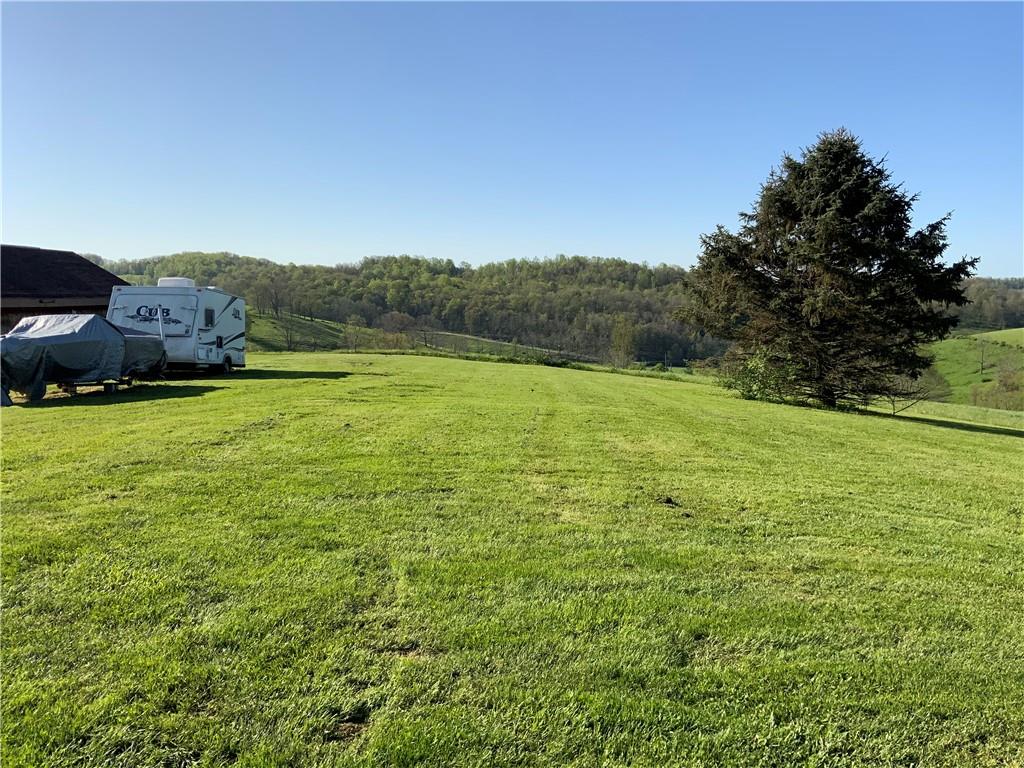 102 Memorial Road West Alexander, PA 15376 - Photo 18 of 19 a view of a big yard with a house