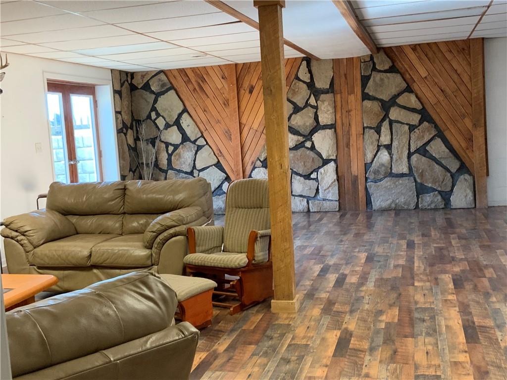 102 Memorial Road West Alexander, PA 15376 - Photo 6 of 19 a living room with furniture a wooden floor and next to a window