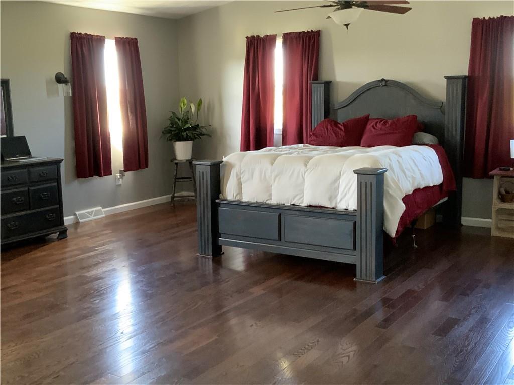 102 Memorial Road West Alexander, PA 15376 - Photo 7 of 19 a bedroom with a bed and wooden floor