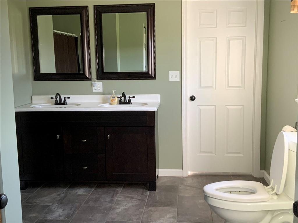 102 Memorial Road West Alexander, PA 15376 - Photo 8 of 19 a bathroom with a toilet a sink a mirror and a shower