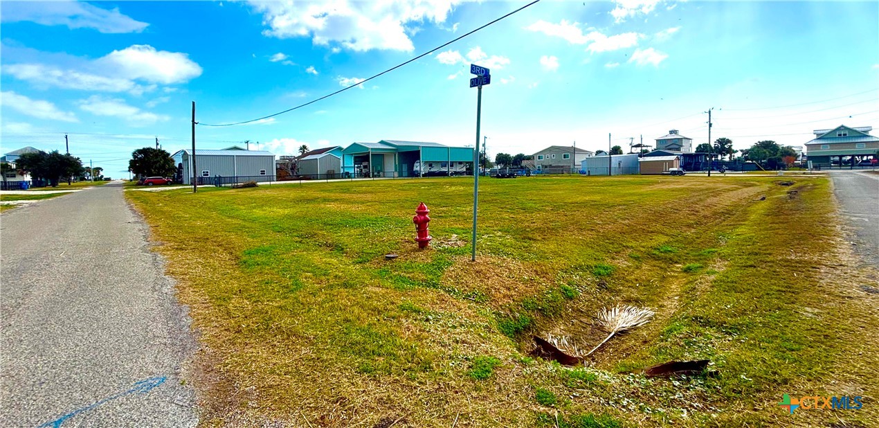 Tbd Olive Street Port O'Connor, TX 77982 - Photo 4 of 9 a view of a swimming pool with a yard