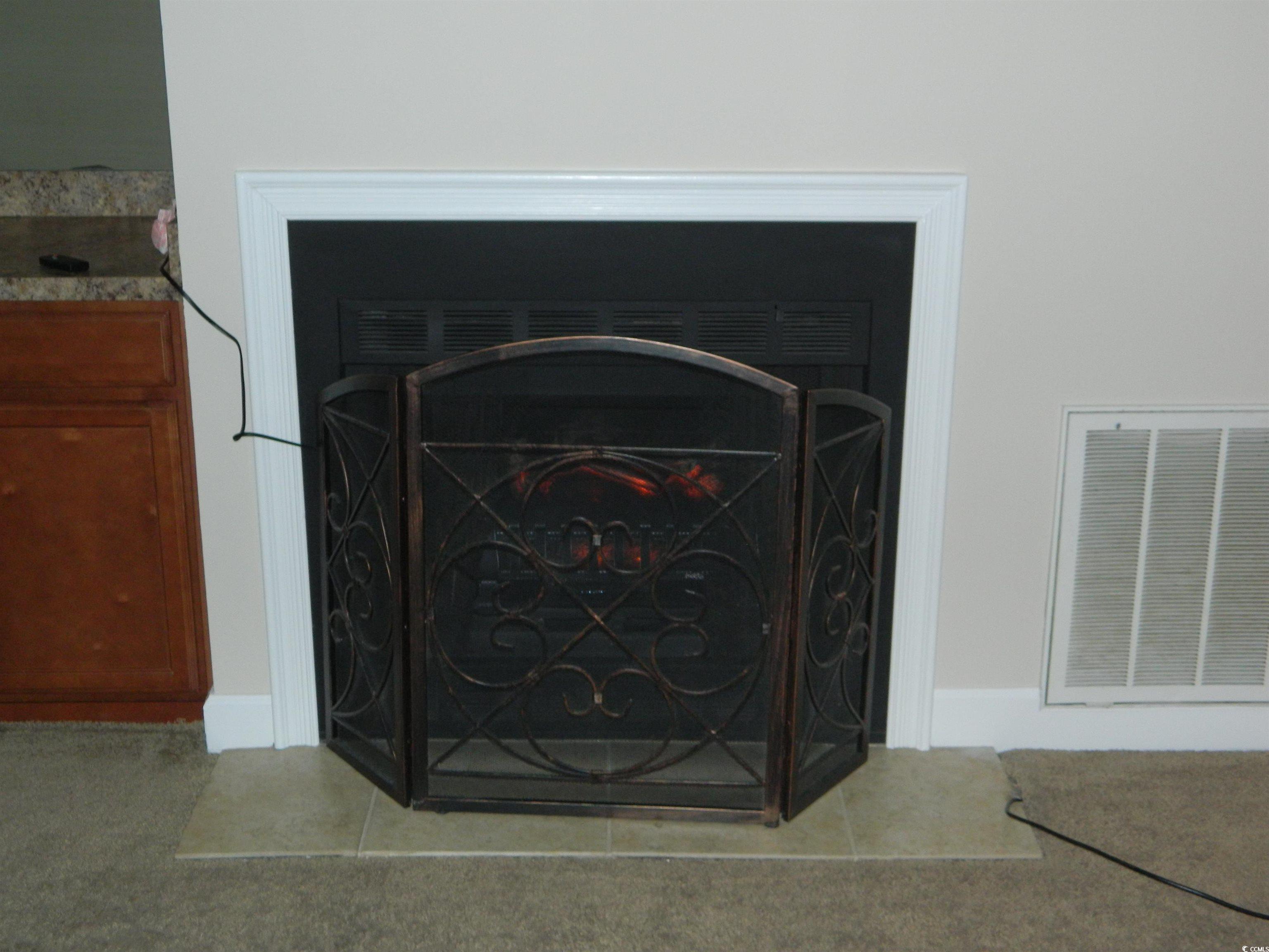 1356 Glenns Bay Road, Unit 103C Surfside Beach, SC 29575 - Photo 3 of 15 Electric fireplace
