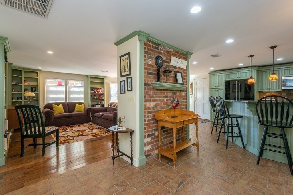 47 Argilla Road Ipswich, MA 01938 - Photo 15 of 42 a living room with furniture a dining table and chairs in it