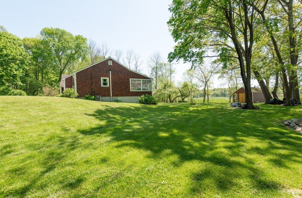 47 Argilla Road Ipswich, MA 01938 - Photo 3 of 42 a big yard with lots of green space and trees