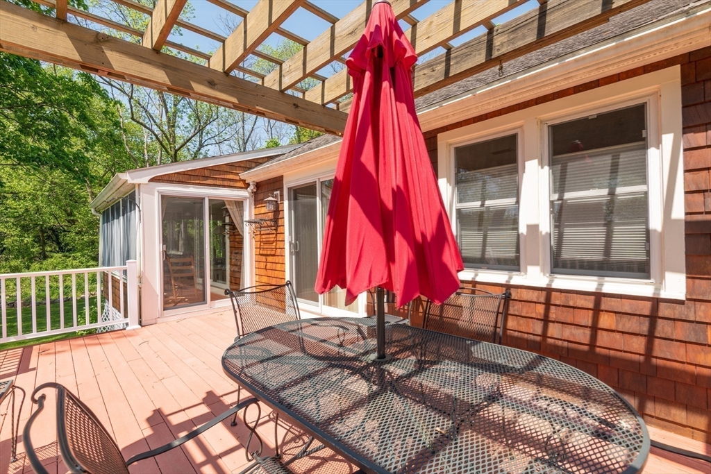 47 Argilla Road Ipswich, MA 01938 - Photo 8 of 42 a view of a backyard with a small deck and furniture