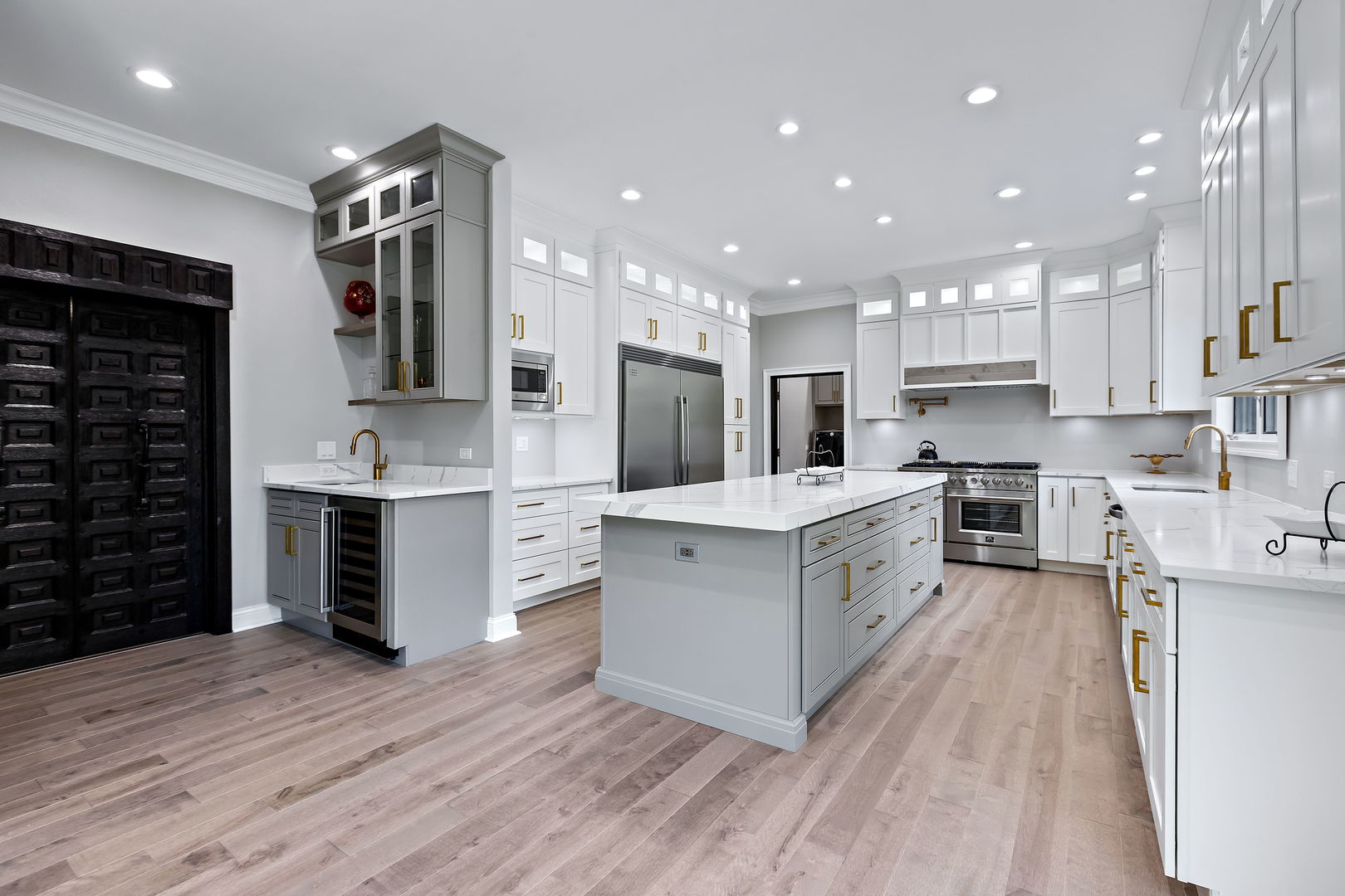3 Saville Row Barrington Hills, IL 60010 - Photo 12 of 53 a large kitchen with stainless steel appliances granite countertop a large center island a stove a refrigerator and a cabinets