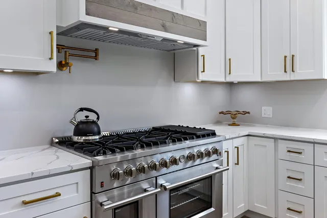 a utility room with sink dryer and washer