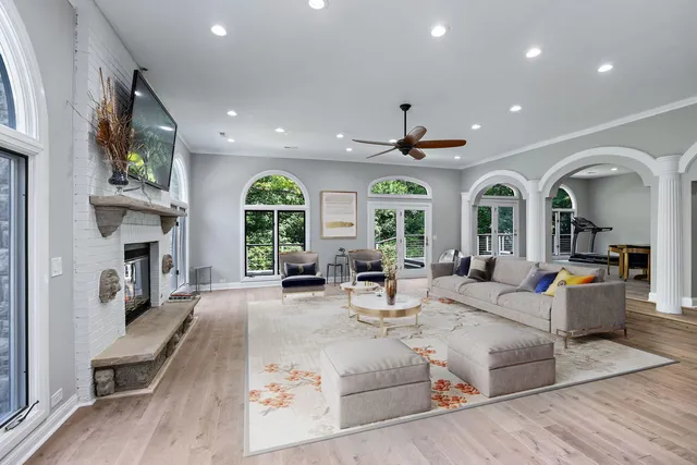 a living room with furniture a window and a fireplace