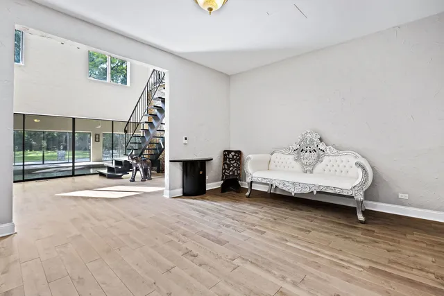 a view of living room with furniture and floor to ceiling window
