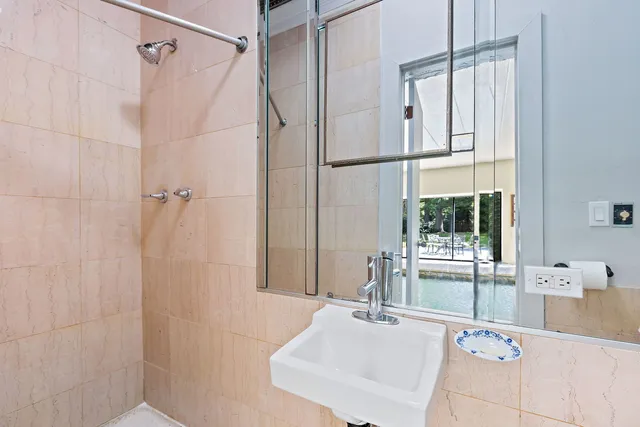 a living room with fireplace furniture and a chandelier