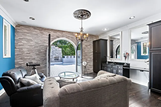 a spacious bathroom with a sink a large mirror and a shower