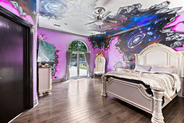 a living room with a couch and a chandelier