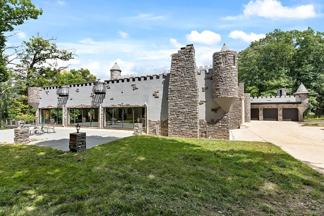 a view of a patio with table and chairs a barbeque with wooden fence